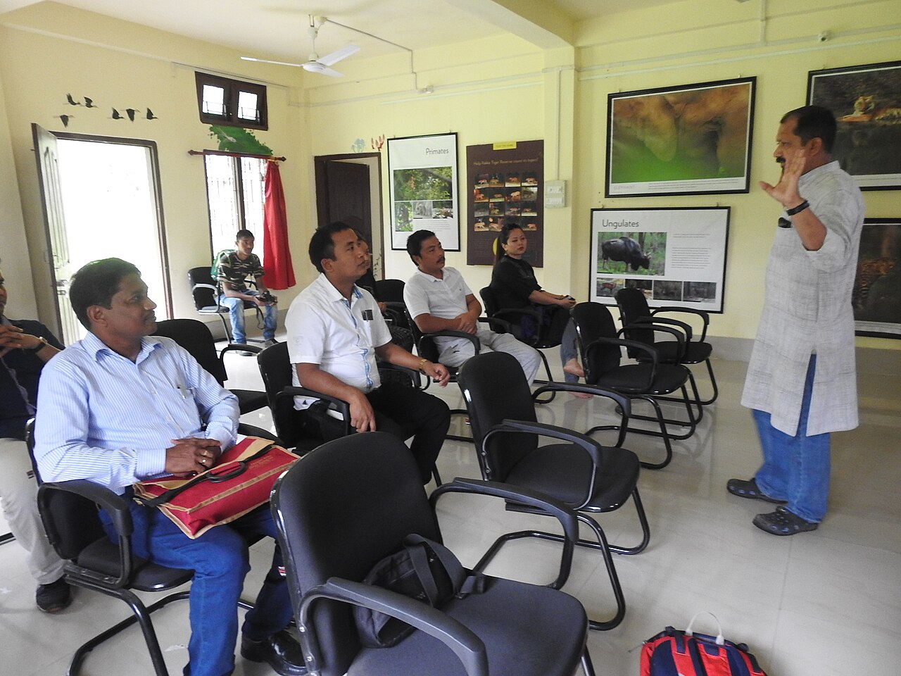 Teachers seated in a training room listening to a facilitator