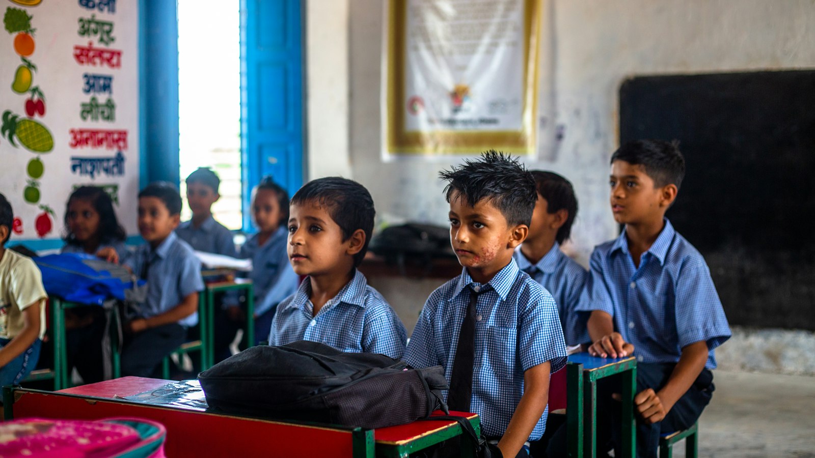 A group of young children sitting in a classroom.