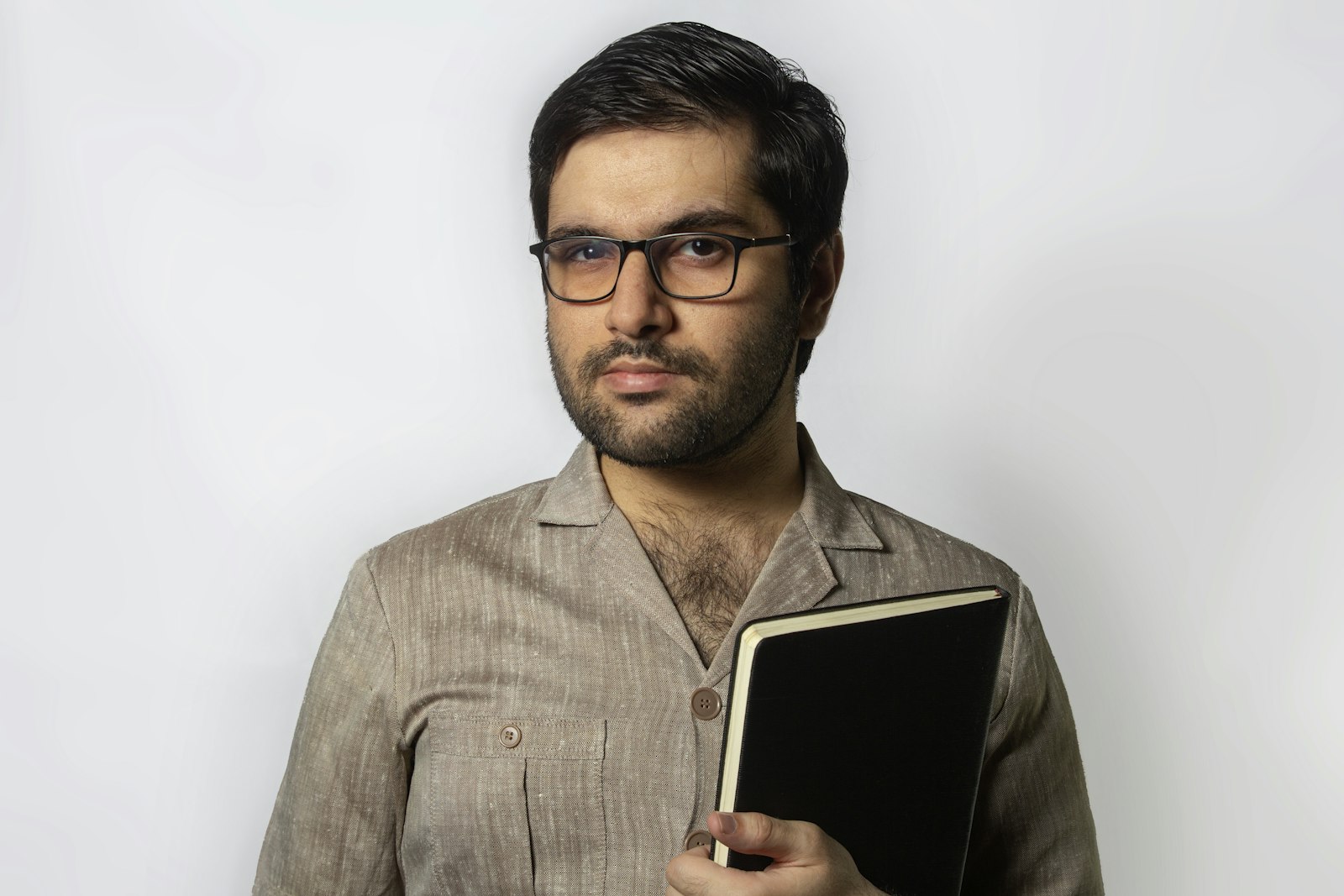 A school administrator holding a tablet