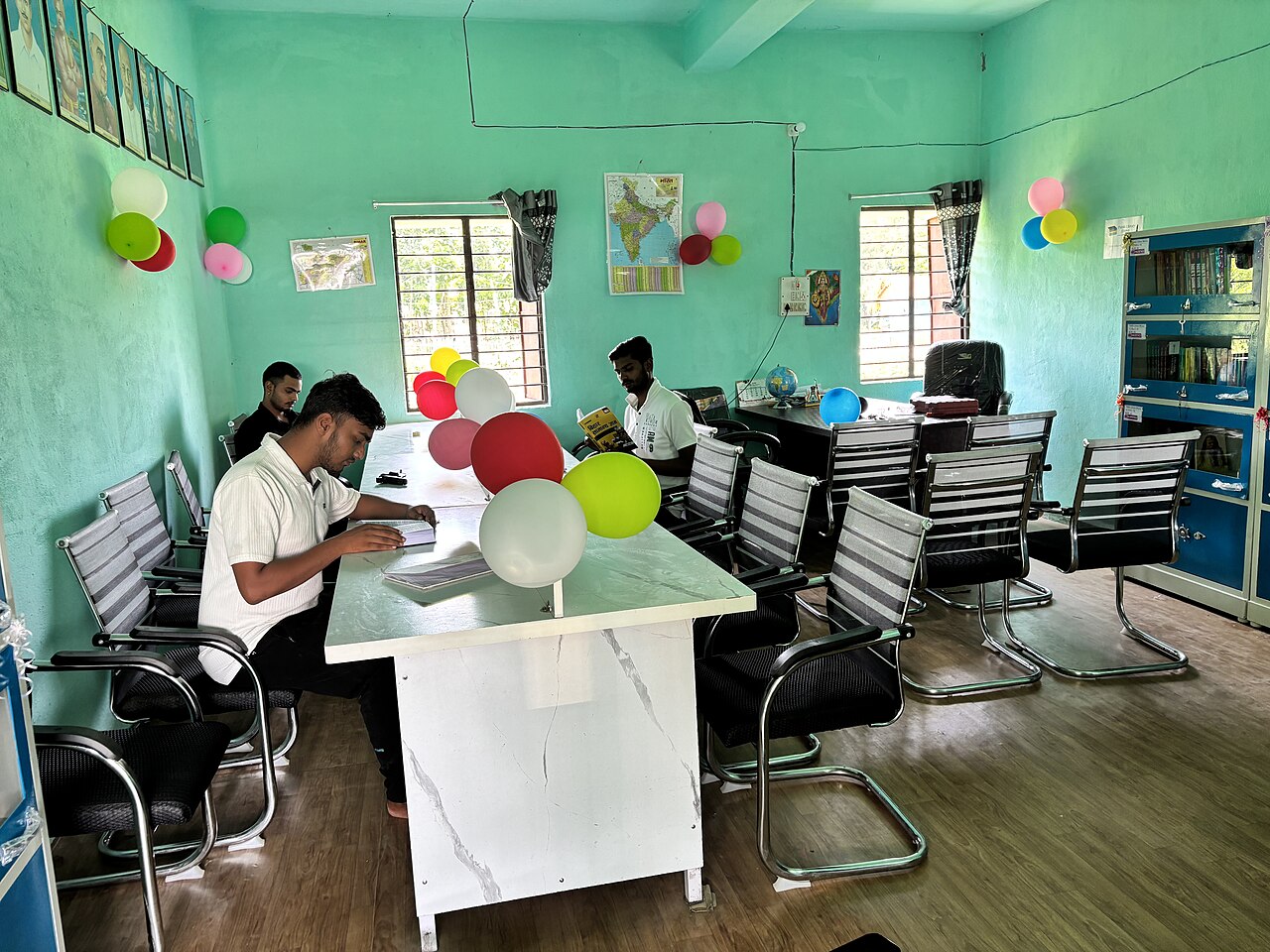 Students reading at tables in a public library