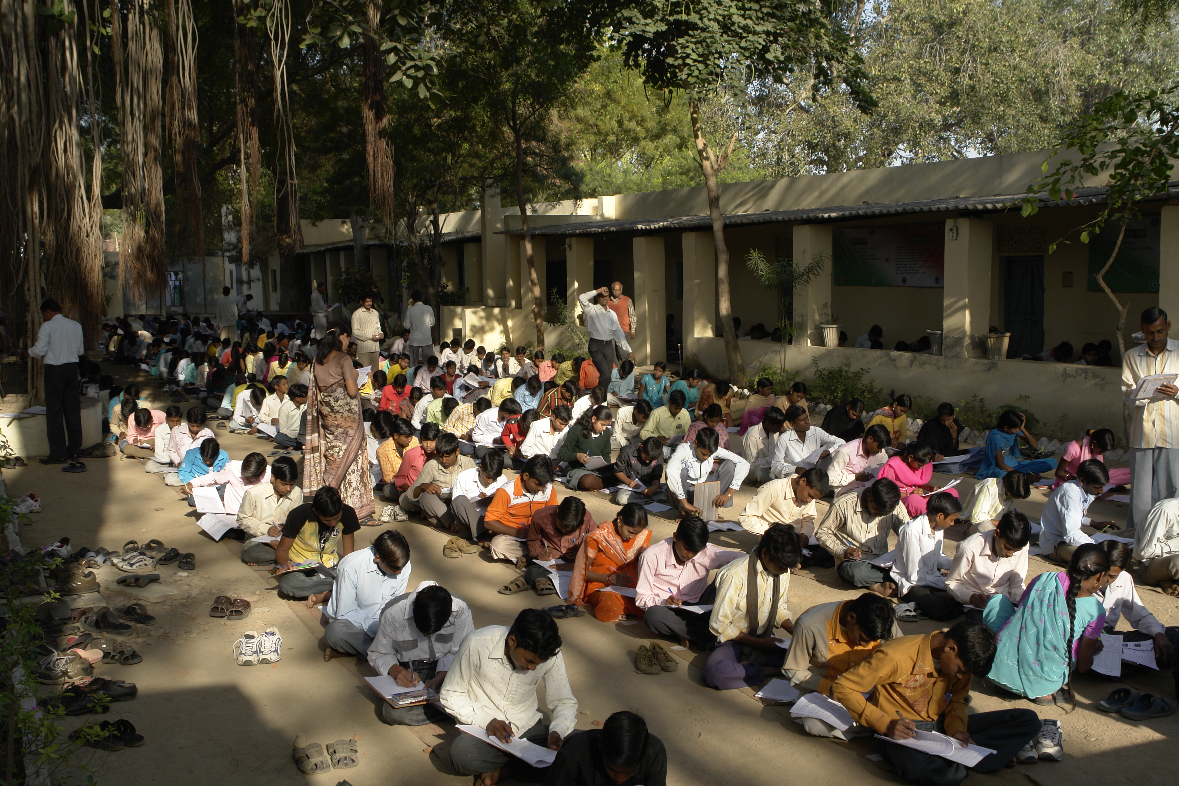 Class 10 students writing their end-of-year Maths exam outdoors in Jaura, Madhya Pradesh
