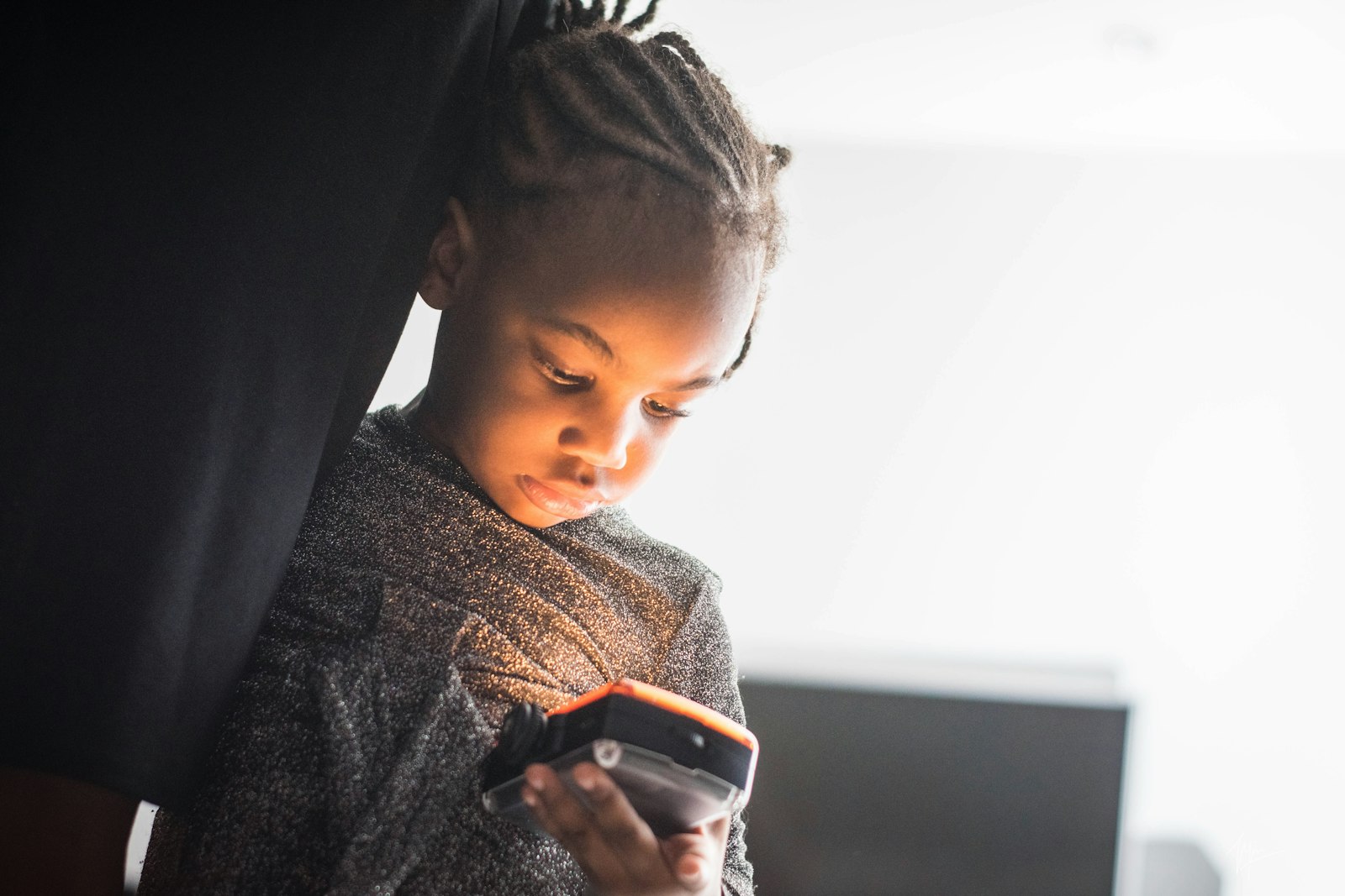 Teenage boy holding a smartphone