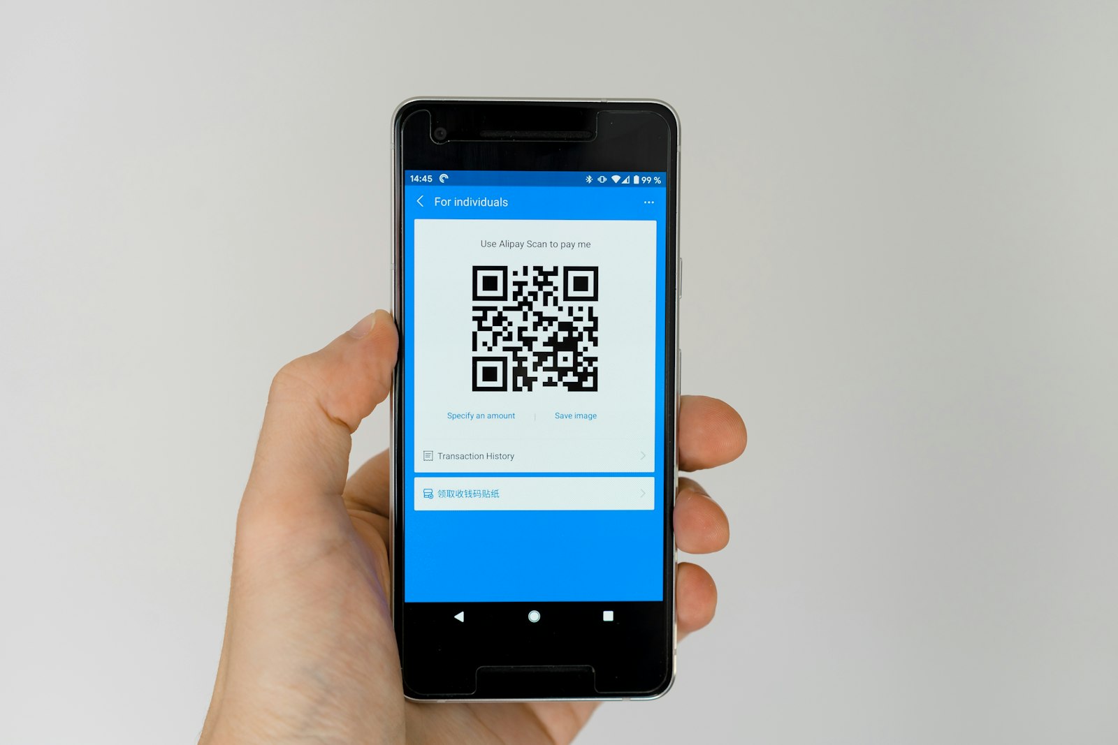 Smartphone showing a QR code for a digital payment